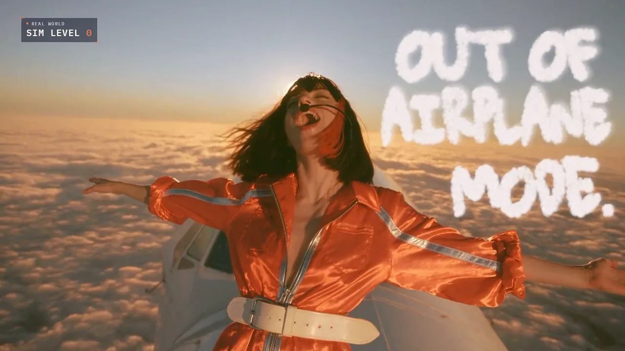 Claudia in an orange flight suit sings above clouds beneath Out of Airplane Mode lettering