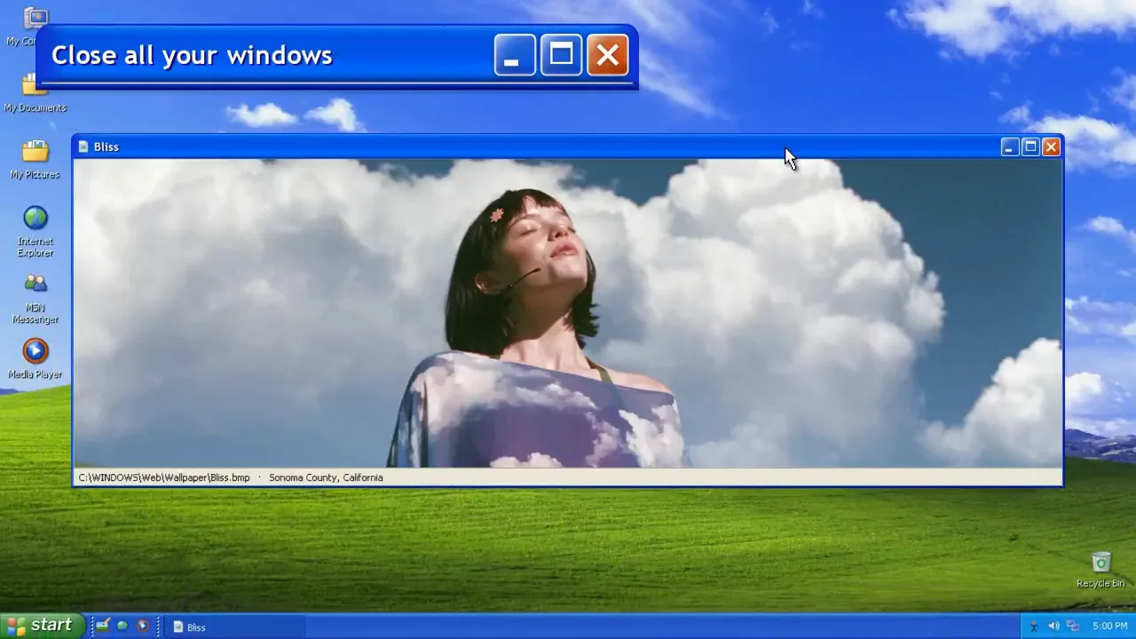 Claudia sings inside a Windows XP window over the Bliss landscape